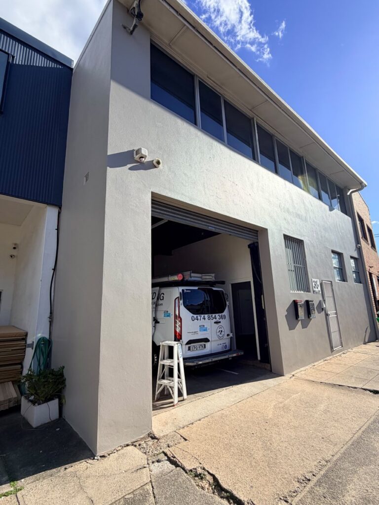 Commercial building exterior repainted in modern grey by AKD Painting, Sydney