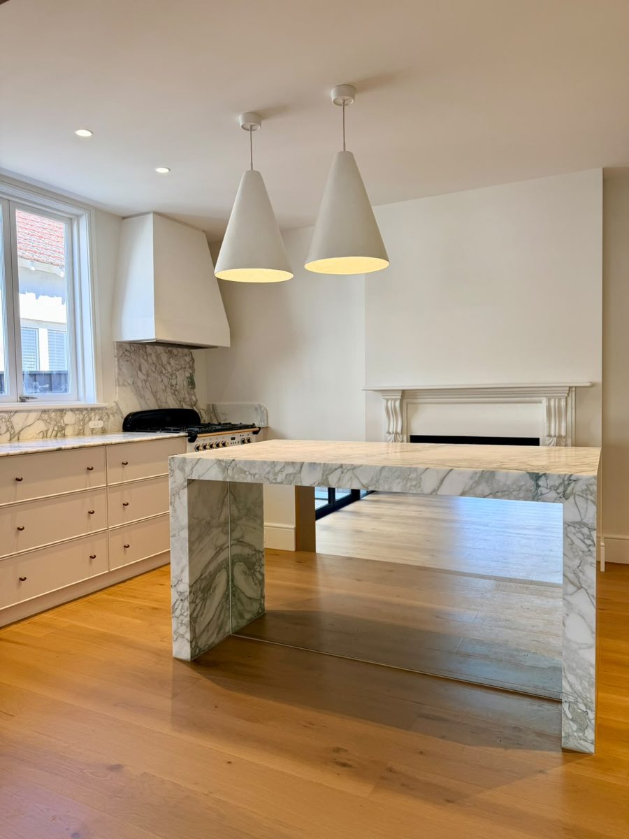 New kitchen in an Annandale extension with marble island, painted walls and rangehood