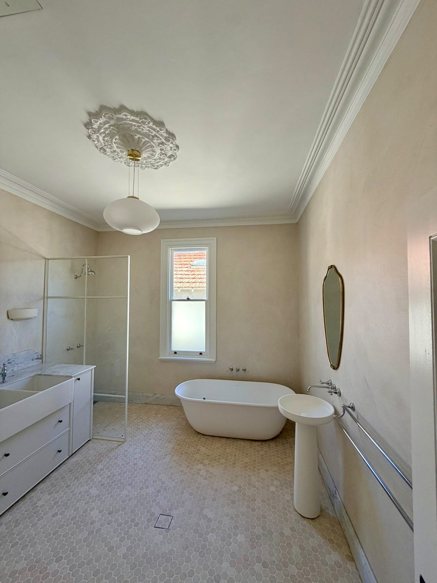 Renovated bathroom in an Annandale period home with ceiling rose and freestanding bath, walls freshly painted