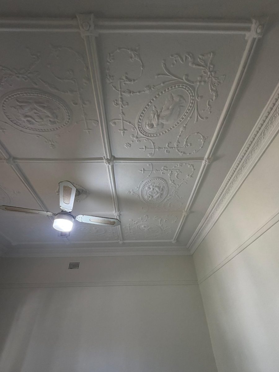 The same pressed metal ceiling in Five Dock after repainting, pattern crisp and white