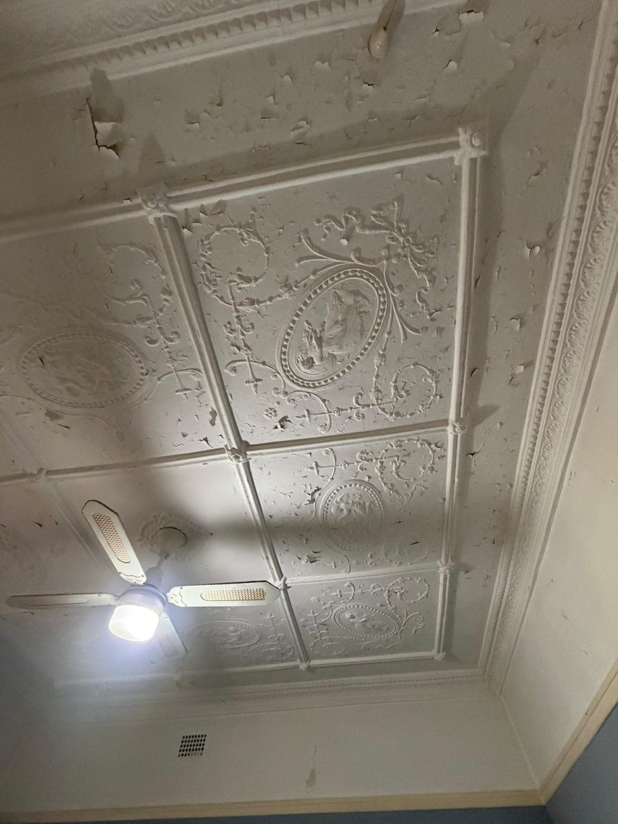 Pressed metal ceiling in a Five Dock Federation home with flaking paint before preparation